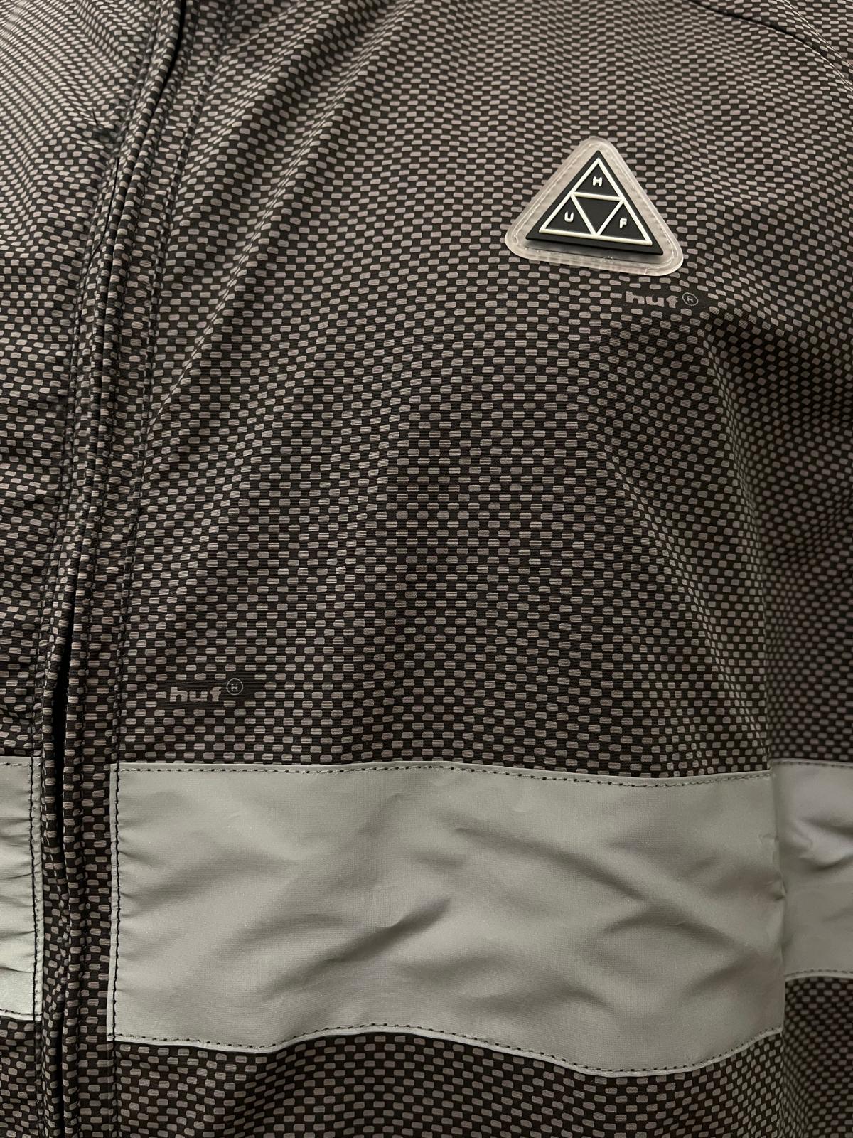 Huf smanicato con tasca sul retro