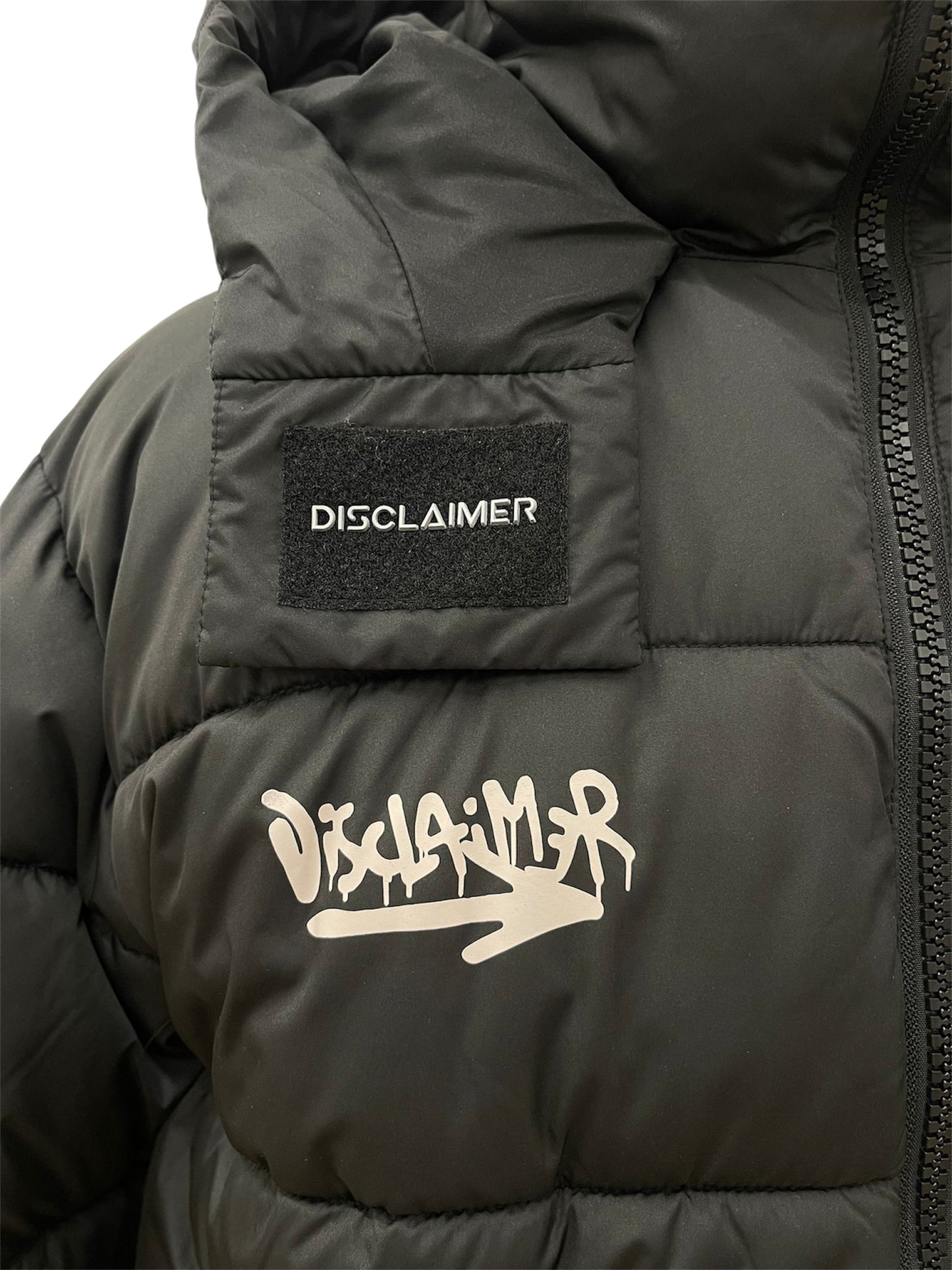 Disclaimer Piumino nero con dettagli logo graffiti