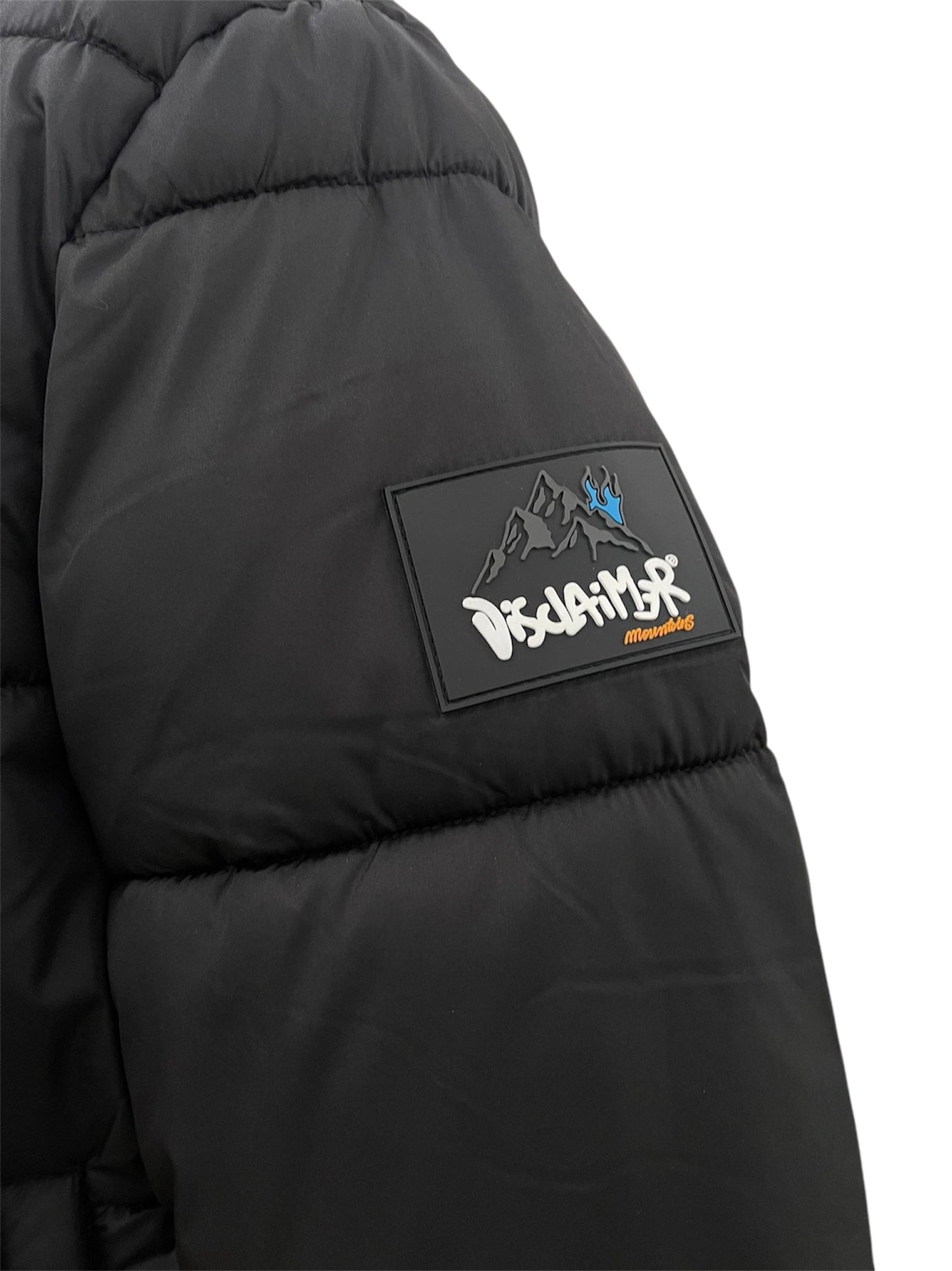 Disclaimer Piumino nero con stampa montagna